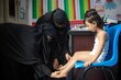 Malnutrition: Health workers assess a girl in a WFP-backed clinic in Aden in February. Photo: WFP/Mohammed Awadh