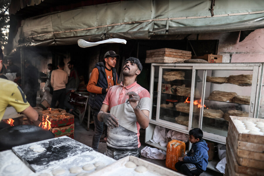 Gazans who can do so exchange wheat flour for traditional 'Saj" flatbread. Despite skyrocketing hunger, many people are fasting and eating only after sunset during this holy Muslim month of Ramadan. Photo: WFP/Ali Jadallah