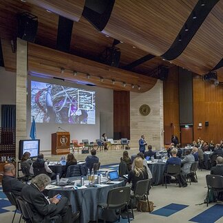 Boardroom filled with people in a meeting. Photo: WFP/Giulio dAdamo